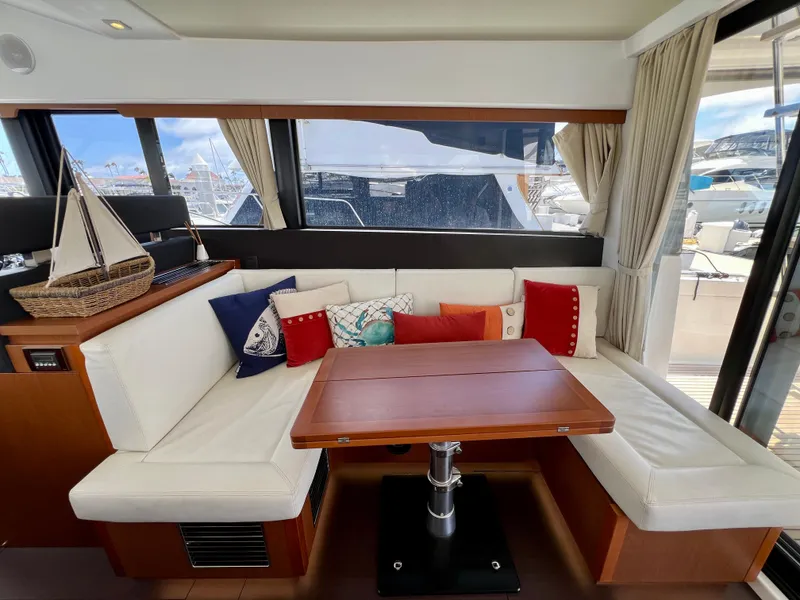Slide: The Image of Luxurious interior of 2017 Jeanneau Velasco 43 yacht with cozy seating and decorative pillows. - 7