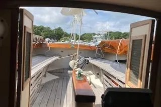 Slide: The Image of Alerion 26 sailboat interior view, wooden deck, open hatch, 1999 model. - 19