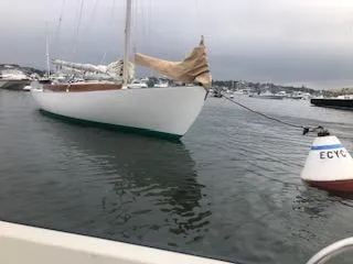 Slide: The Image of Alerion 26 sailboat from 1999 moored near buoy in calm waters. - 5