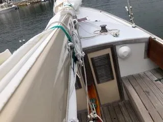 Slide: The Image of Sailboat deck view, Alerion 26, 1999 model, docked on calm water. - 9