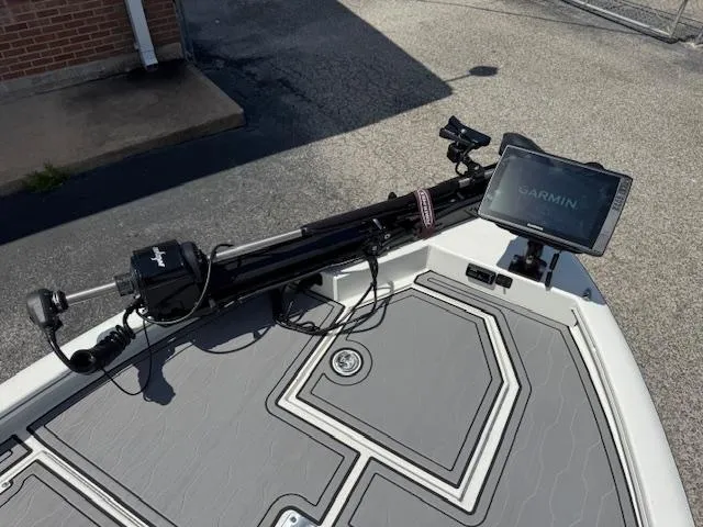 Slide: The Image of Avid 23 Mag 2025 boat deck with Garmin navigation system and trolling motor. - 11