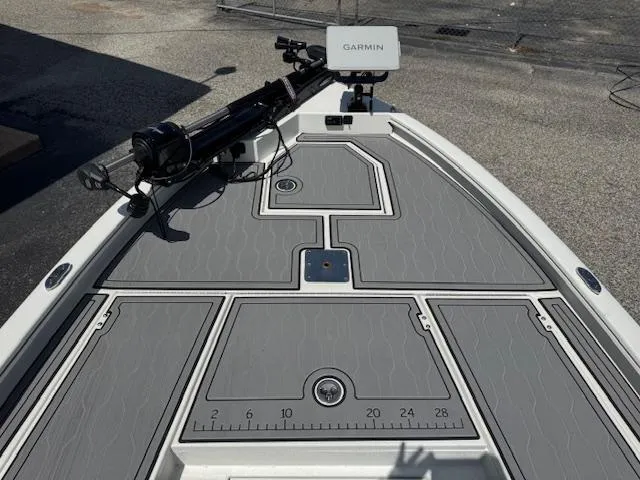 Slide: The Image of 2025 Avid 23 Mag boat deck with Garmin equipment, featuring gray non-slip surface. - 14
