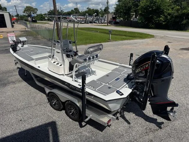 Slide: The Image of Avid 23 Mag 2025 boat on trailer with powerful outboard motor, parked outdoors. - 3
