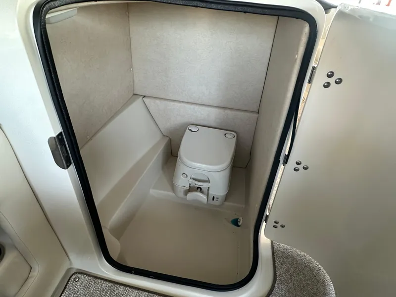 Slide: The Image of Compact marine toilet in 2010 Sea Ray 240 Sundeck boat cabin. - 10