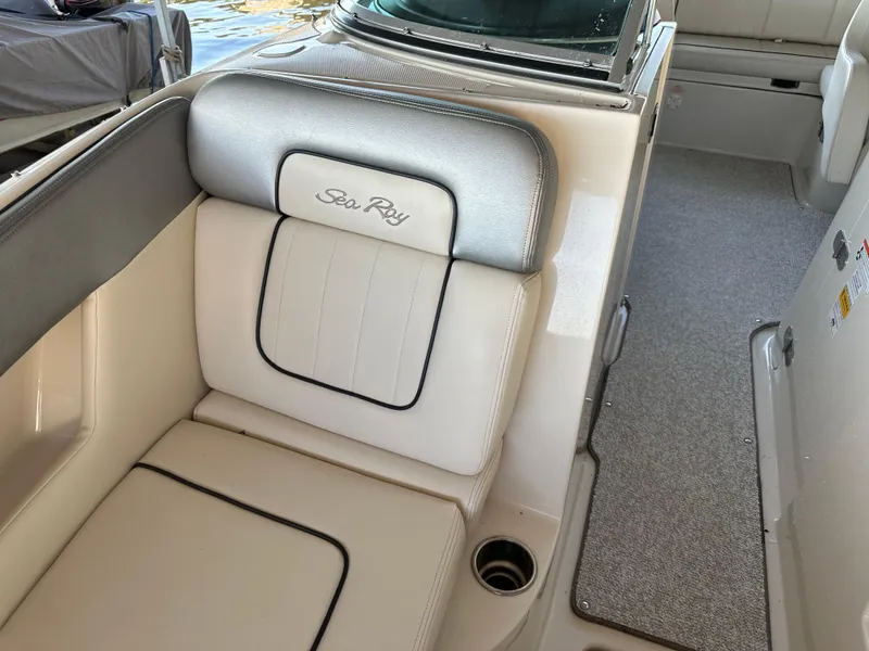 Slide: The Image of Interior seating of 2010 Sea Ray 240 Sundeck boat, featuring plush upholstery. - 23