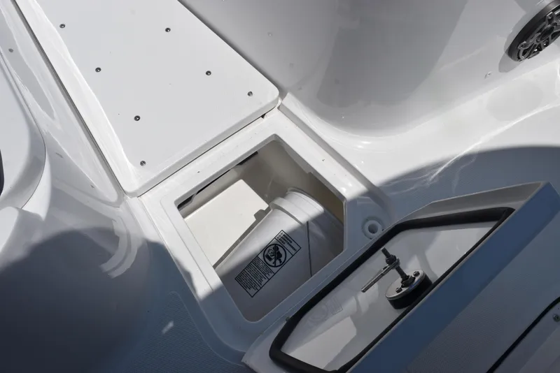 Slide: The Image of 2026 Sea Hunt Gamefish 30 Forward Seating storage compartment with open hatch and visible bucket. - 15