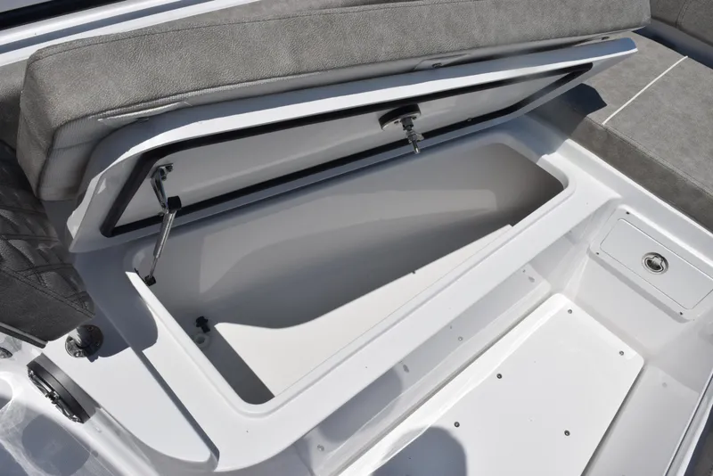 Slide: The Image of 2026 Sea Hunt Gamefish 30 Forward Seating storage compartment with open lid. - 17