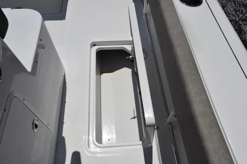 Slide: The Image of Open storage compartment on 2026 Sea Hunt Gamefish 30 Forward Seating boat. - 21