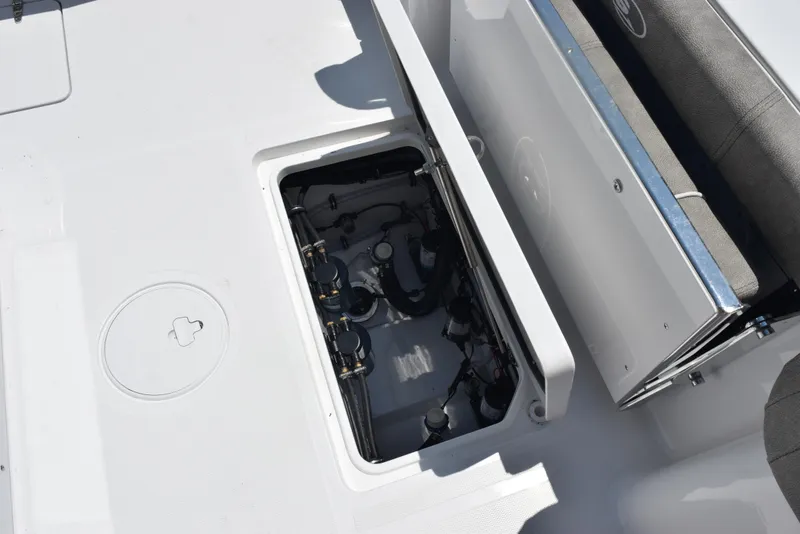 Slide: The Image of 2026 Sea Hunt Gamefish 30 Forward Seating boat with open storage compartment. - 23