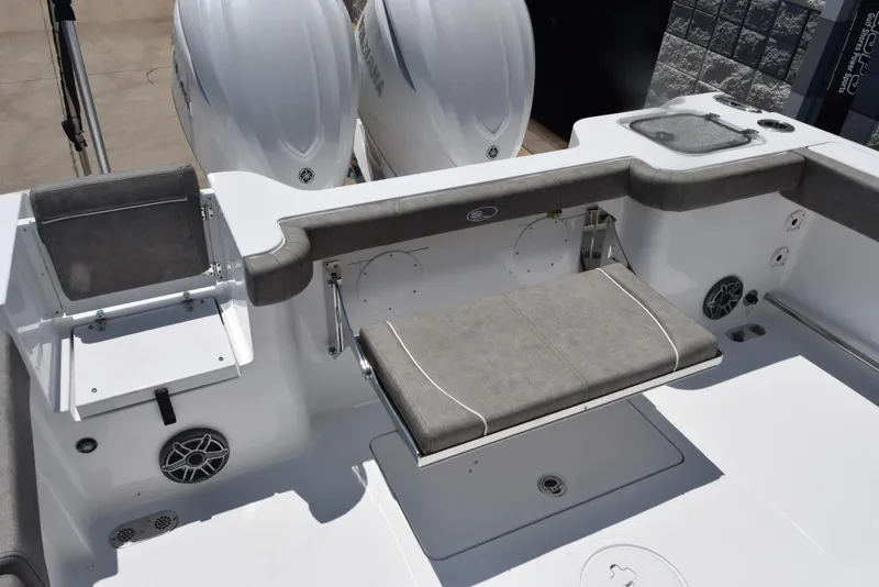 Slide: The Image of 2026 Sea Hunt Gamefish 30 boat interior with forward seating and dual engines. - 8