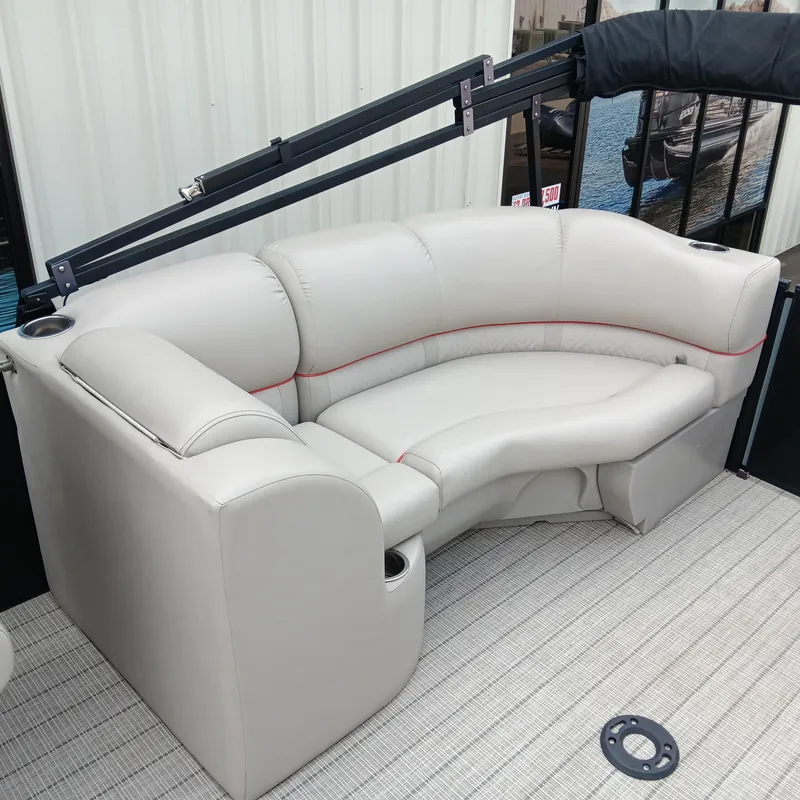 Slide: The Image of Luxurious seating on 2017 Cypress Cay Seabreeze 213 pontoon boat, featuring plush white upholstery. - 11