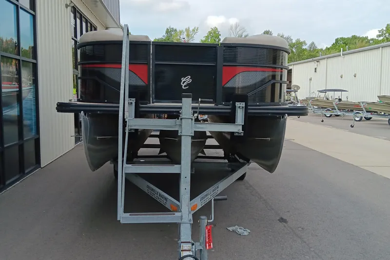 Slide: The Image of 2017 Cypress Cay Seabreeze 213 pontoon boat on trailer, parked outside a building. - 3