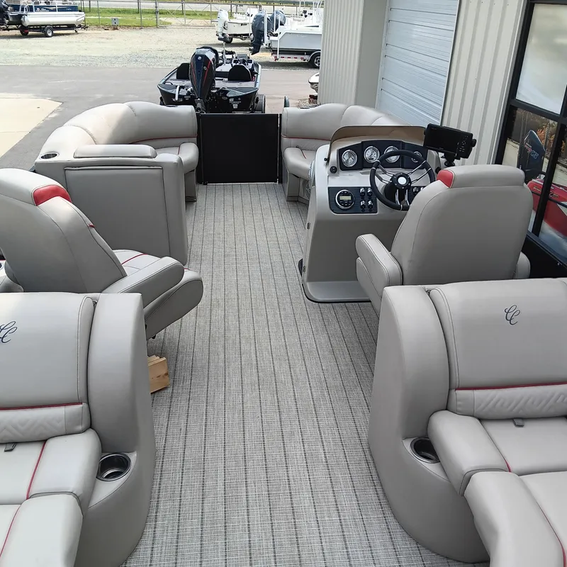 Slide: The Image of 2017 Cypress Cay Seabreeze 213 pontoon boat interior with plush seating and modern dashboard. - 4
