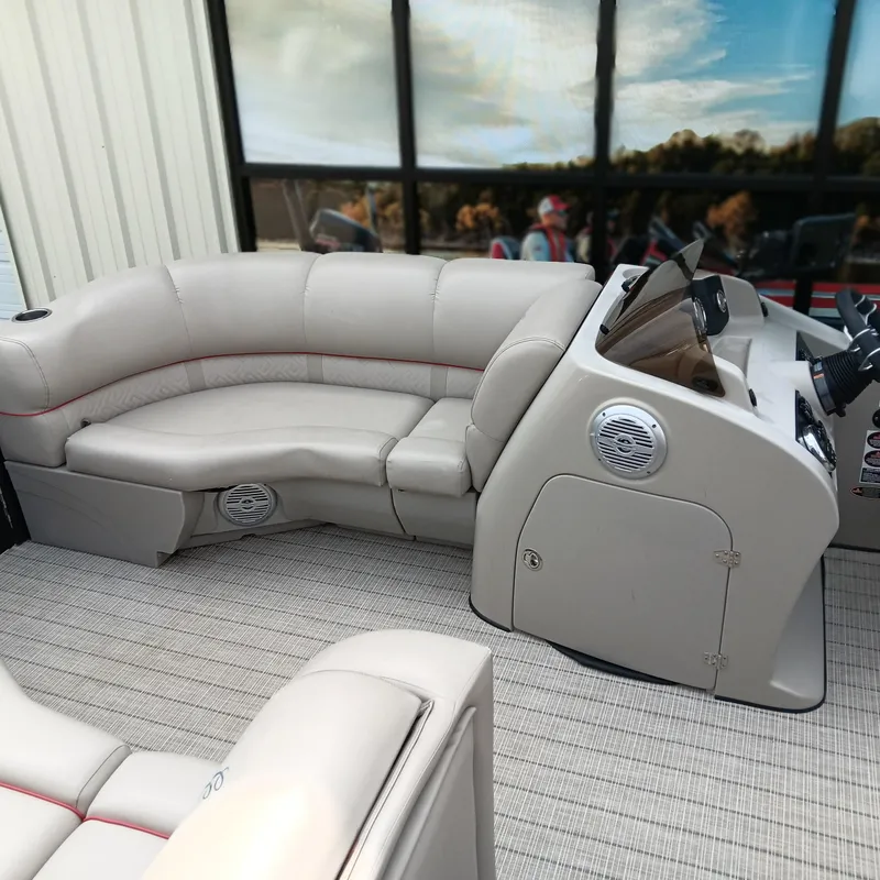 Slide: The Image of 2017 Cypress Cay Seabreeze 213 boat interior with beige seating and modern dashboard. - 6