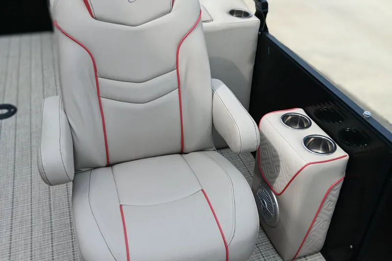 Slide: The Image of 2017 Cypress Cay Seabreeze 213 boat seat with cup holders and red trim accents. - 9