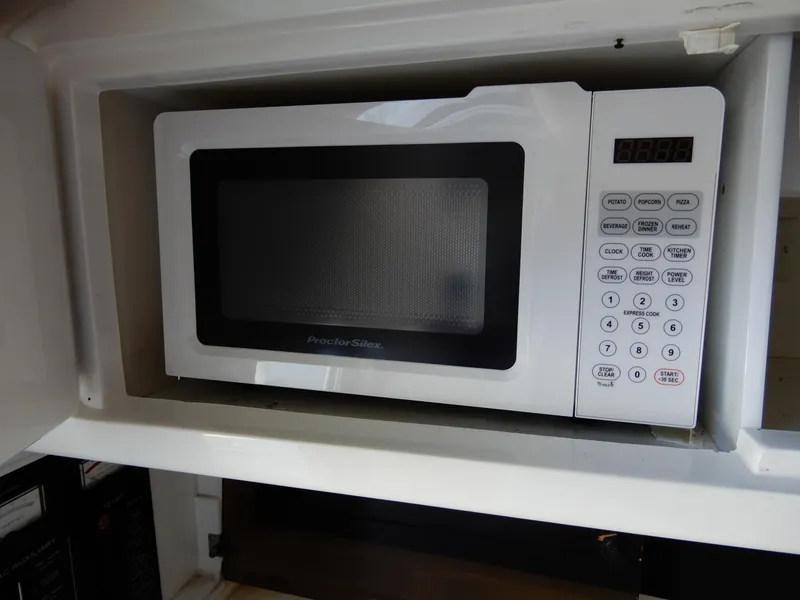 Slide: The Image of Built-in Proctor Silex microwave in 2003 Cobalt 293 boat kitchen. - 12