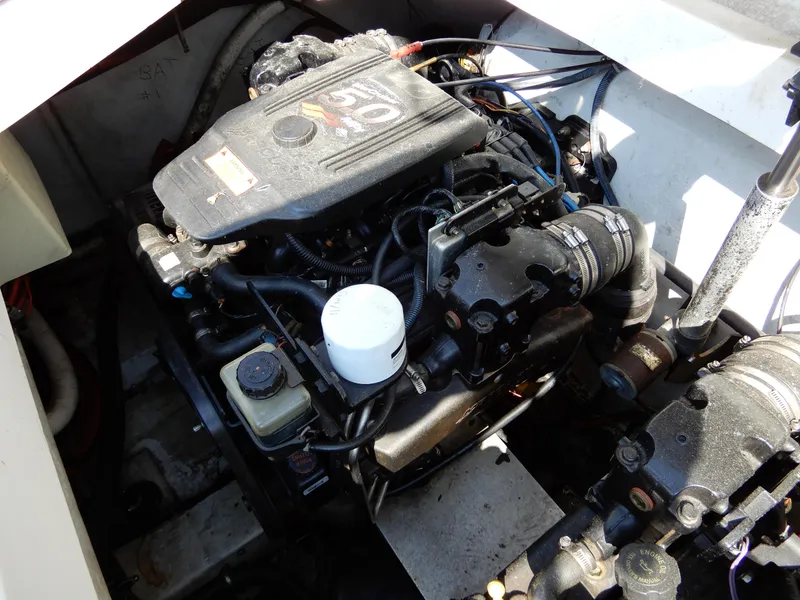 Slide: The Image of Engine compartment of a 2003 Cobalt 293 boat, featuring a 5.0L engine. - 18