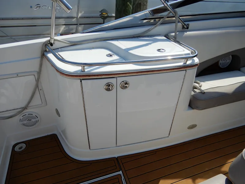 Slide: The Image of 2003 Cobalt 293 boat interior with teak flooring and sleek cabinetry. - 3