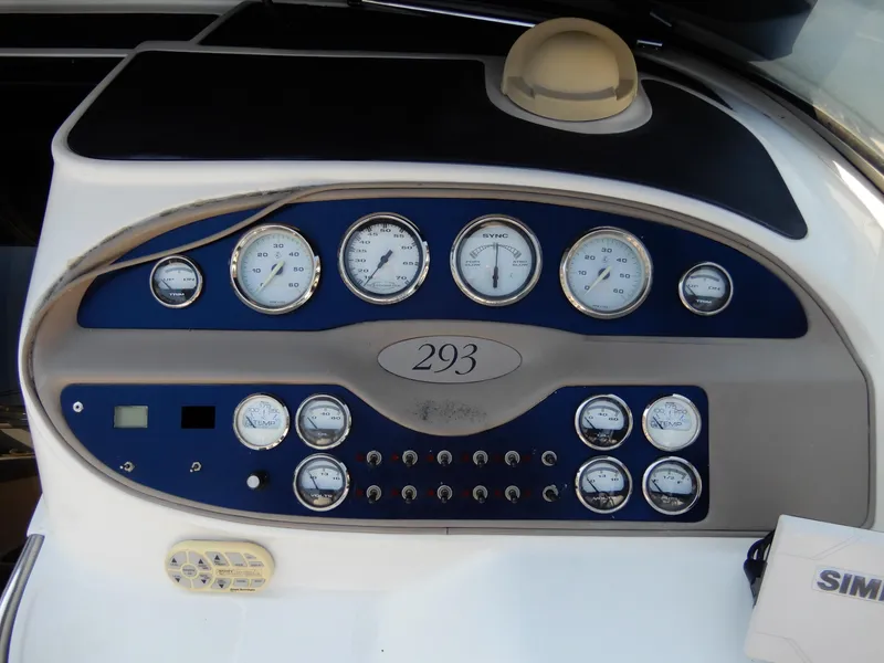 Slide: The Image of Dashboard of a 2003 Cobalt 293 boat with gauges and controls. - 7
