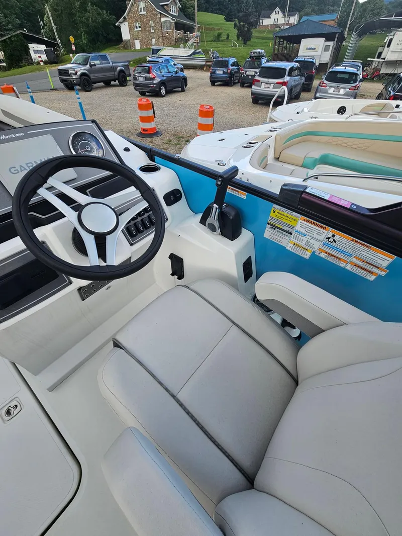 Slide: The Image of Interior of 2024 Hurricane FD 1960 RE3 OB boat with steering wheel and seating. - 8
