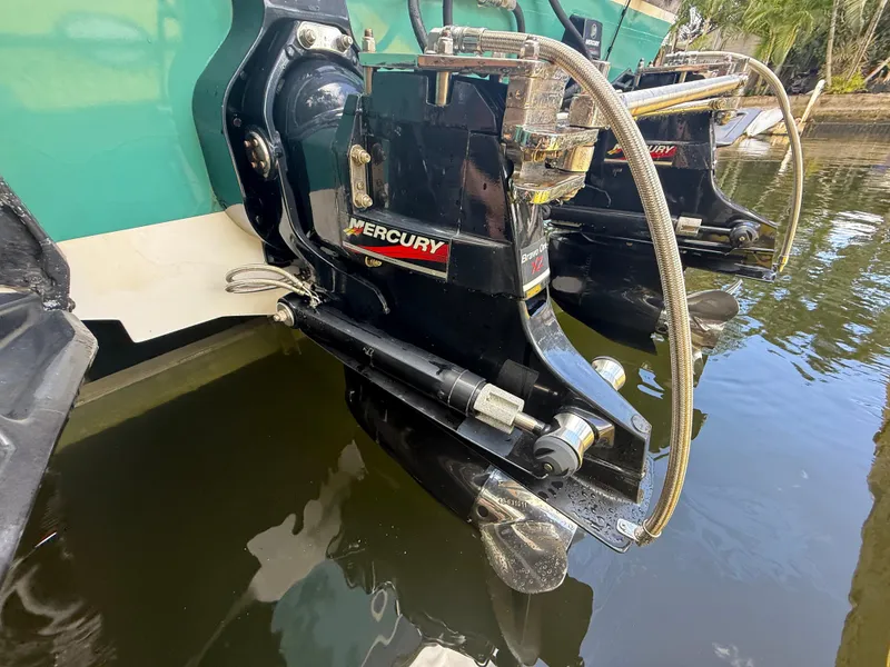 Slide: The Image of 1988 Wellcraft Scarab 38 KV with Mercury outboard engines in water. - 13