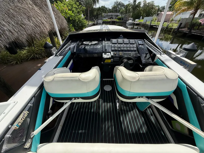 Slide: The Image of 1988 Wellcraft Scarab 38 KV boat interior with dual seats and control panel. - 23
