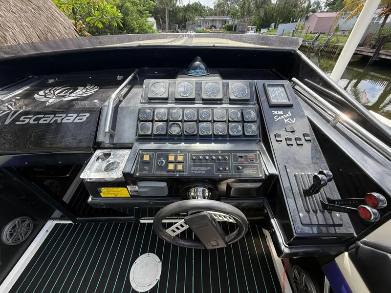 Slide: The Image of Dashboard of a 1988 Wellcraft Scarab 38 KV boat with gauges and controls. - 26