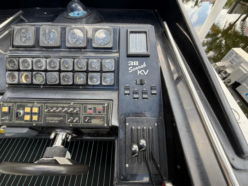 Slide: The Image of Dashboard of a 1988 Wellcraft Scarab 38 KV boat with gauges and controls. - 28