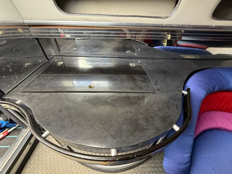 Slide: The Image of Interior of 1988 Wellcraft Scarab 38 KV boat with sleek black surfaces and colorful seating. - 34