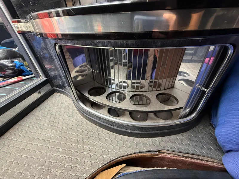 Slide: The Image of 1988 Wellcraft Scarab 38 KV interior detail with circular storage compartments and metallic accents. - 37