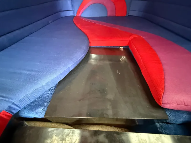 Slide: The Image of Interior of 1988 Wellcraft Scarab 38 KV with blue and red seating. - 47