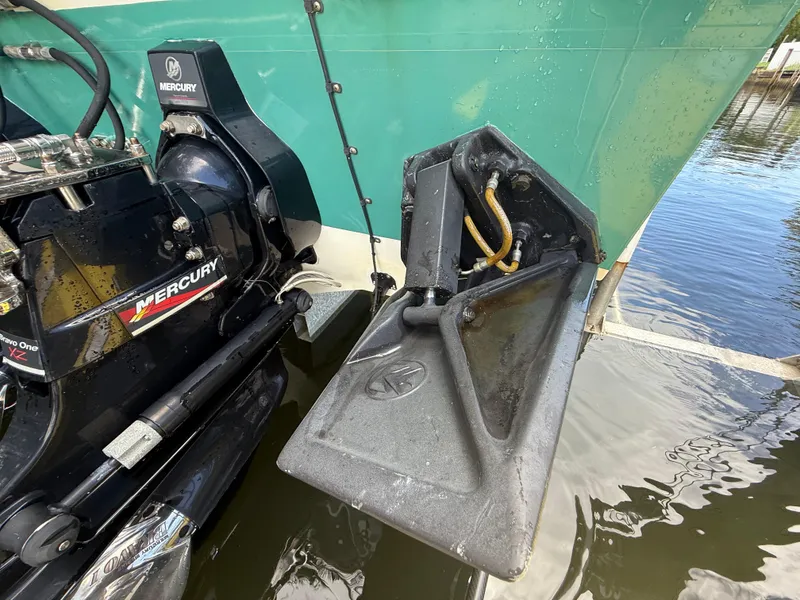 Slide: The Image of 1988 Wellcraft Scarab 38 KV with Mercury engine, close-up of trim tab and outdrive. - 8