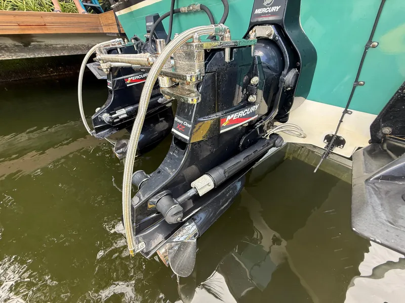 Slide: The Image of 1988 Wellcraft Scarab 38 KV with Mercury Bravo One outdrives in water. - 9