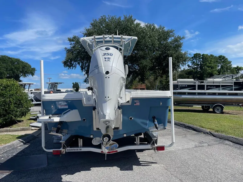 Slide: The Image of 2026 Bay Rider 269 Bay boat with 350 V6 engine, parked outdoors on a sunny day. - 3
