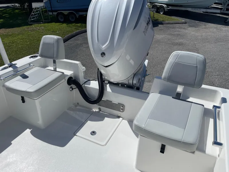 Slide: The Image of 2026 Bay Rider 269 Bay boat interior with seating and outboard motor. - 6