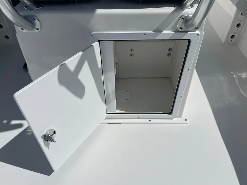 Slide: The Image of Open storage compartment on 2026 Bay Rider 269 Bay boat. - 15