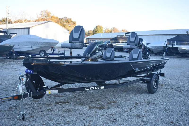 Slide: The Image of 2025 Lowe Stinger 175 boat on trailer, parked outdoors at a dealership. - 4
