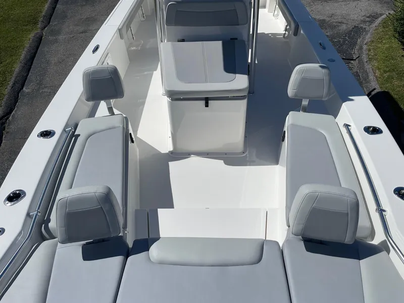 Slide: The Image of 2026 Bay Rider 269 Bay boat interior with gray seating and sleek design. - 10
