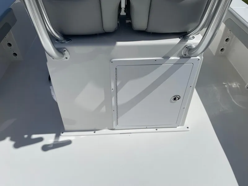 Slide: The Image of 2026 Bay Rider 269 Bay boat interior with storage compartment and seating. - 14