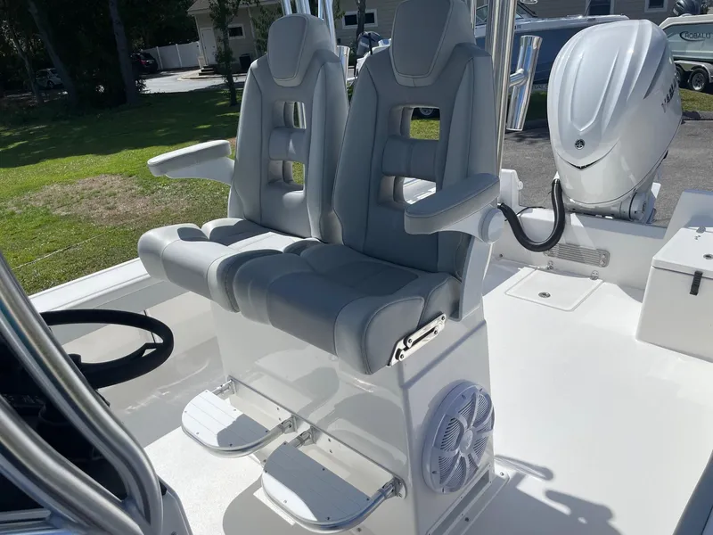Slide: The Image of 2026 Bay Rider 269 Bay boat with dual gray captain seats and Yamaha engine. - 20