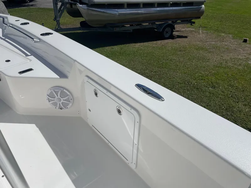 Slide: The Image of 2026 Bay Rider 269 Bay boat interior with speaker and storage compartment. - 23