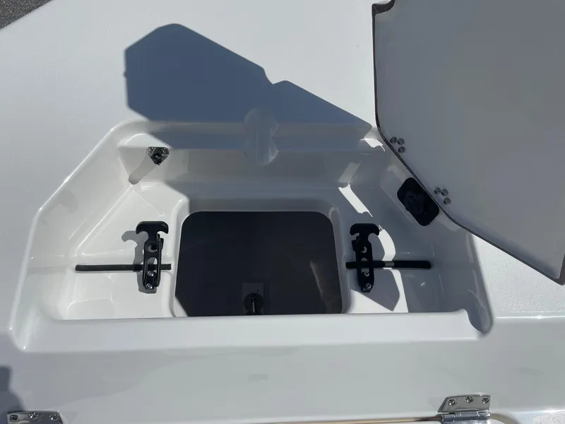 Slide: The Image of Open storage compartment on 2026 Bay Rider 269 Bay boat, featuring secure latches and sleek design. - 29