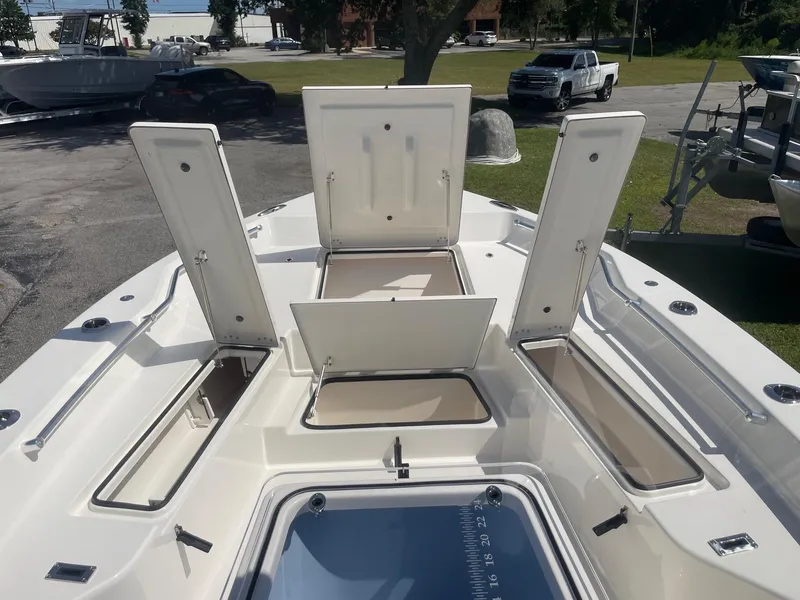 Slide: The Image of Open storage compartments on 2026 Bay Rider 269 Bay boat deck. - 34