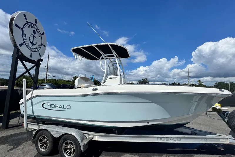 Slide: The Image of 2017 Robalo R200 Center Console boat on trailer under blue sky. - 0