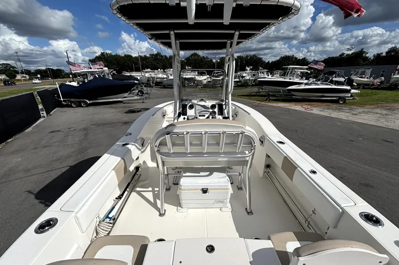 Slide: The Image of 2017 Robalo R200 Center Console boat at a marina, surrounded by other boats. - 12