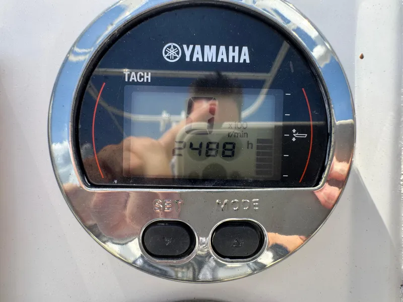 Slide: The Image of Yamaha tachometer displaying 2488 hours on a 2017 Robalo R200 Center Console boat. - 21