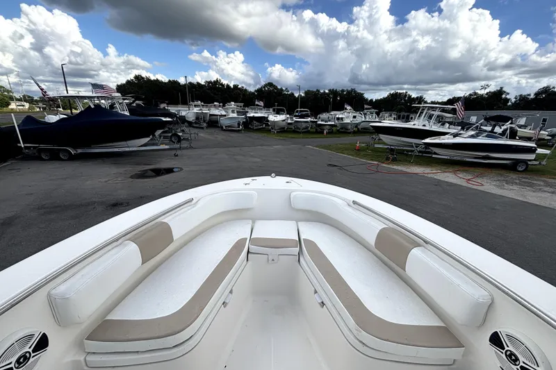 Slide: The Image of 2017 Robalo R200 Center Console boat at a marina with other boats. - 24