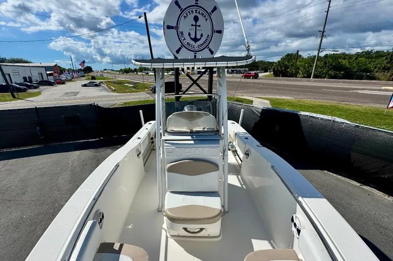 Slide: The Image of 2017 Robalo R200 Center Console boat on display, featuring spacious seating and sleek design. - 26