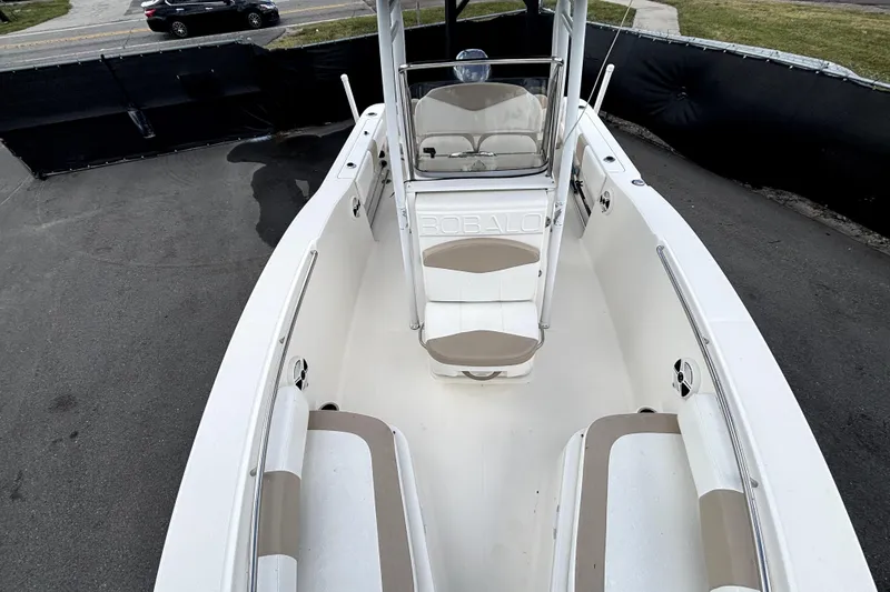 Slide: The Image of 2017 Robalo R200 Center Console boat interior with seating and console view. - 28