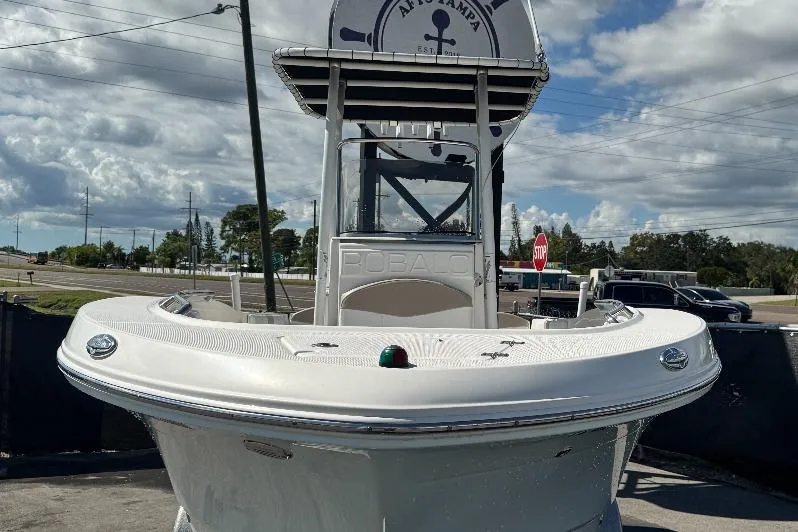 Slide: The Image of 2017 Robalo R200 Center Console boat displayed outdoors under cloudy sky. - 3